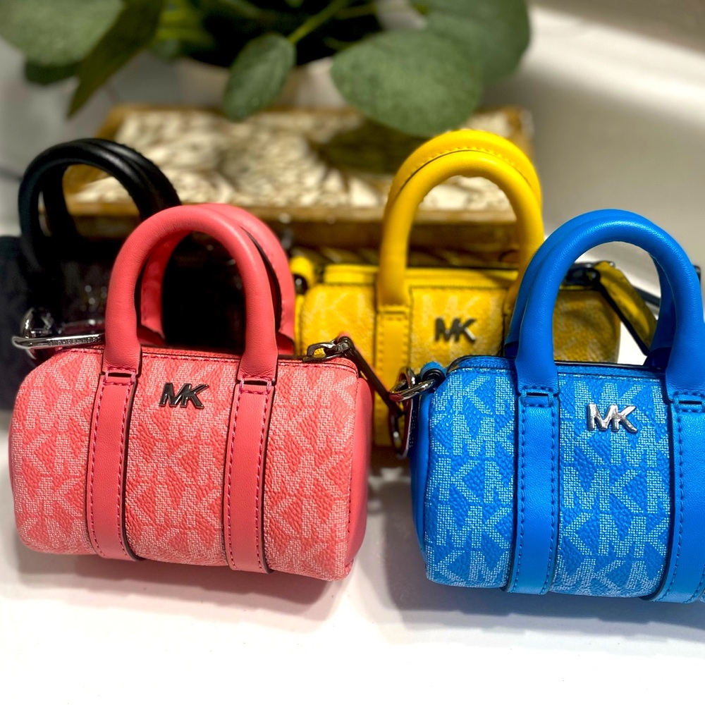 4 Michael Kors mini keychain bags.